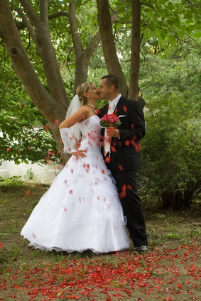 newlyweds and rose petals