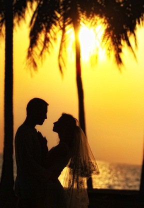 newlyweds at sunset