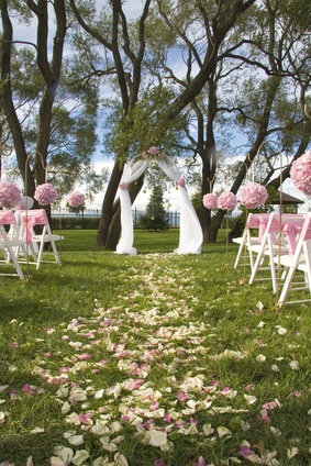 Outdoor wedding arch and chairs