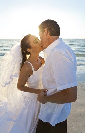 newlywed kiss on the beach