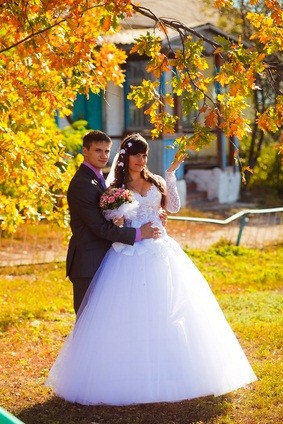 newlyweds outside in autumn