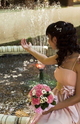 bride by fountain