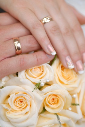 newlywed's hands with rings