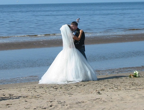 newlyweds on beach