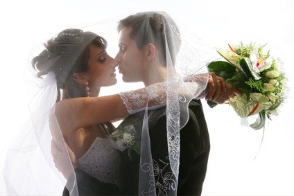 kissing groom bride