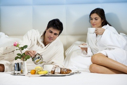 newlyweds having breakfast in bed
