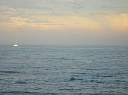 sailboat at sunset on water
